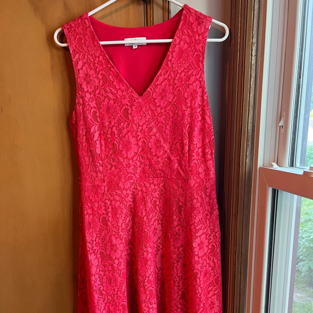 Coral colored lacy knee length dress. Purchased at Jacqueline Riu In France.